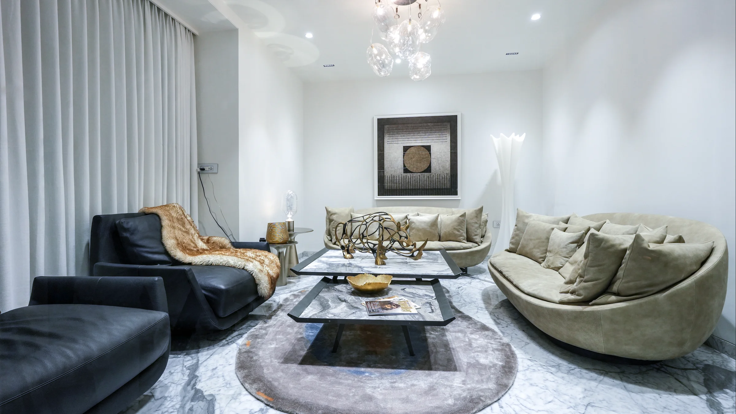 Luxury furniture showroom with premium sofa and sculptural decor